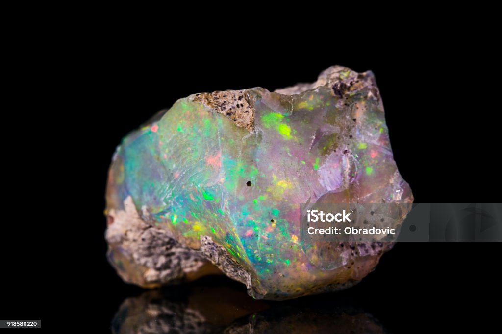 Indonesian opal Indonesian opal isolated on black background Opal Stock Photo