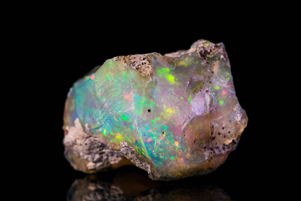 Indonesian opal Indonesian opal isolated on black background opal photos stock pictures, royalty-free photos & images