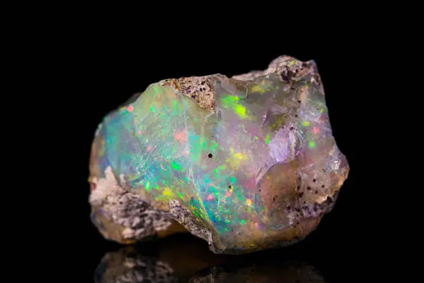 Indonesian opal isolated on black background