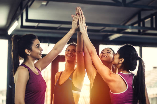 istock Athletes high fiving after successful workout. 918580404