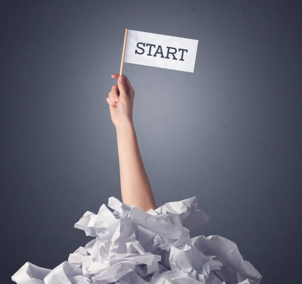 istock Female hand holding start sign 918586582