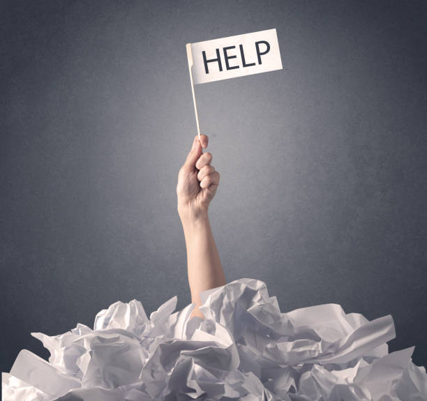istock Female hand holding help sign 918586740