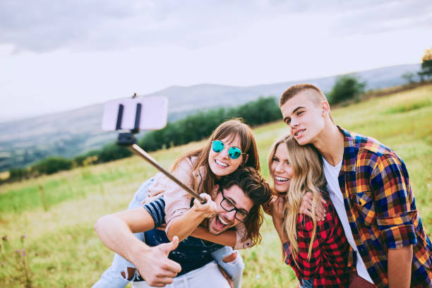 istock Group of friends taking a selfie. 918590832