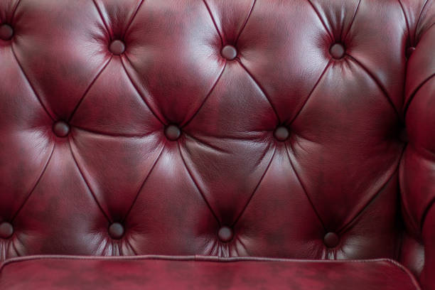 istock Closeup texture of vintage red leather sofa for background 918609000