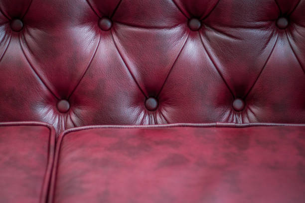 istock Closeup texture of vintage red leather sofa for background 918609076