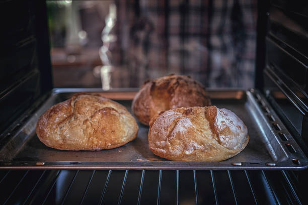 istock Baking Homemade Brown Bread in the Oven 918609530
