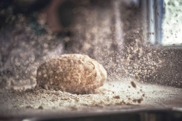 Kneading Loaf of Bread with Hands Kneading Loaf of Bread with Hands wholegrain flour stock pictures, royalty-free photos & images