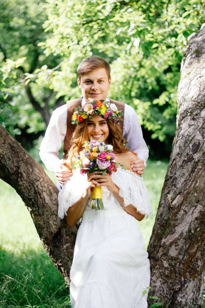 istock Happy bride and groom faces at wedding day celebration outdoor. 918610128