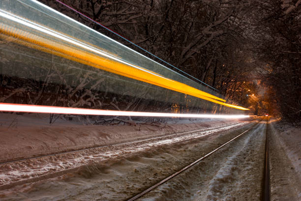 istock Tram riding fast in the forest at night 918616566
