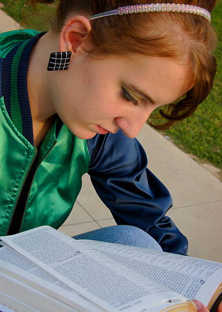 istock female teen student studying - bible 91861740