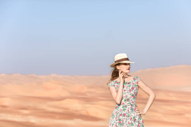istock Young woman walking around desert. 918621166