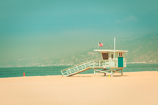 Vintage retro toned view on lifeguard hut on Santa Monica beach California