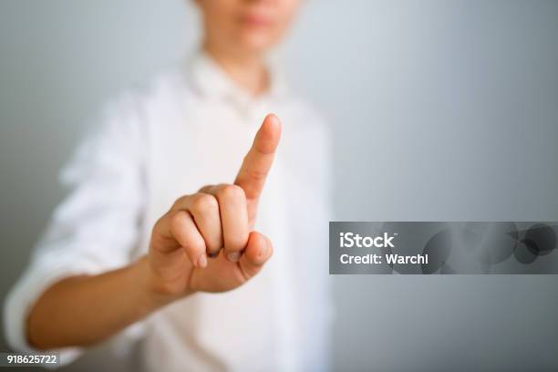 Young Woman Touching Digital Screen Stock Photo - Download Image Now - Device Screen, Touching, Pointing