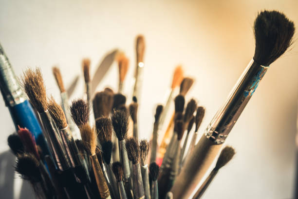 istock Set of art brushes for drawing in a glass on a table 918626244