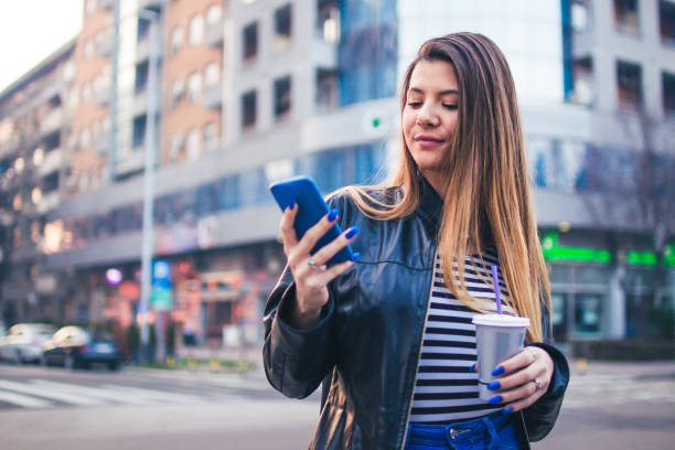 istock Young woman looking at mobile phone. 918633048