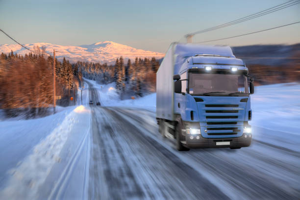 istock Blue truck driving on road 918633266