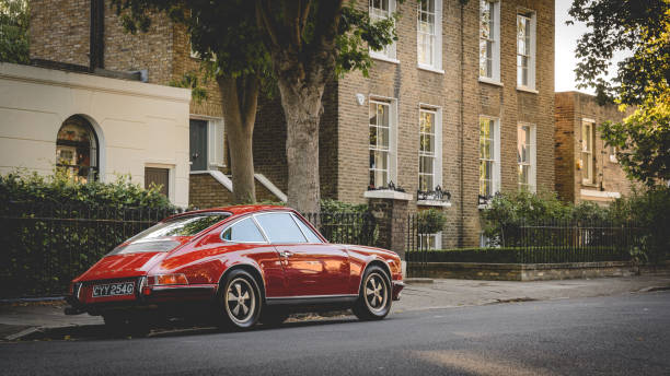 Vintage red Porsche parked in a street. London, UK - July, 2015. Vintage red Porsche parked in a street of Canonbury in North London. inner london stock pictures, royalty-free photos & images