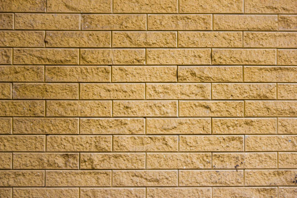 istock Background of yellow brick wall 918642434