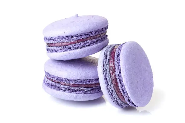 Photo of Three violet macarons on white