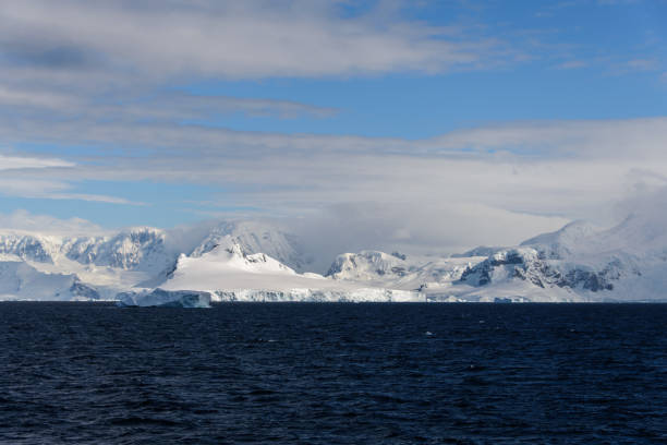 istock Antarctic landscape with sea and mountains 918645738