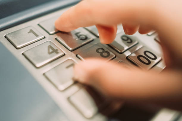 istock Woman withdraws money from an atm 918645816