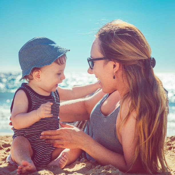 istock Mother and son playing on the beach 918646690