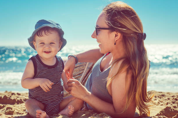 istock Mother and son playing on the beach 918646724