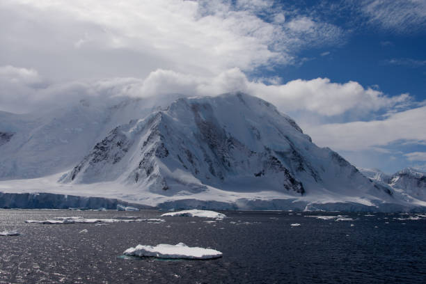 istock Antarctic landscape with sea and mountains 918648840