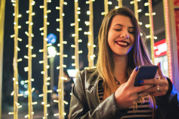 istock Smiling girl with mobile phone. 918649684