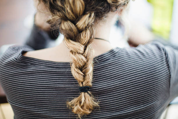 istock rear view young woman with a braid 918656434