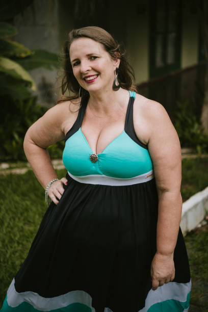 istock Woman in front of house 918663290