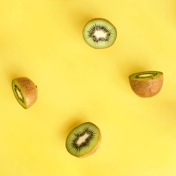 istock cut in half kiwi fruit on a yellow background 918663712