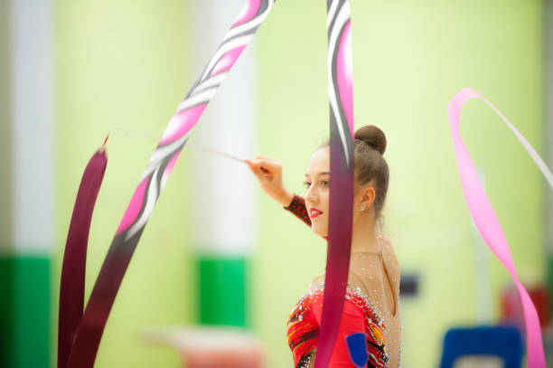 istock Teenage Rhythmic Gymnastics Athlete Doing Ribbon Routine 918664104