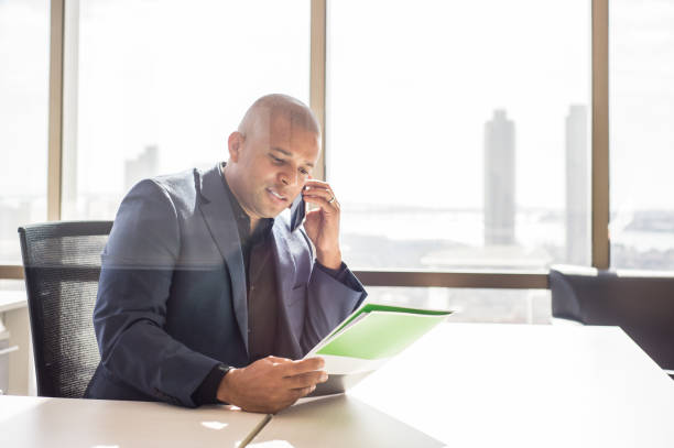 istock Man In The Office With A View Of Downtown 918670640