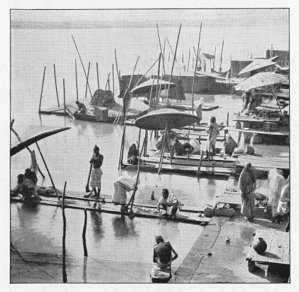 Piers along the Ganges River in Benares, India during the british era. Vintage halftone circa late 19th century. Benares is now modern day Varanasi.