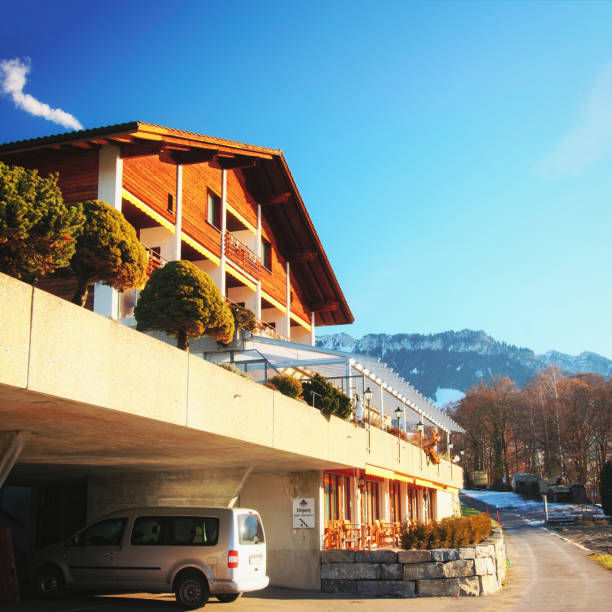 Building with garage at Swiss Alps mountains Thun lake Sigriswil, Switzerland - December 31, 2013: Building with garage placed at Swiss Alps mountains and Thun lake, Switzerland in winter thun interlaken winter switzerland stock pictures, royalty-free photos & images