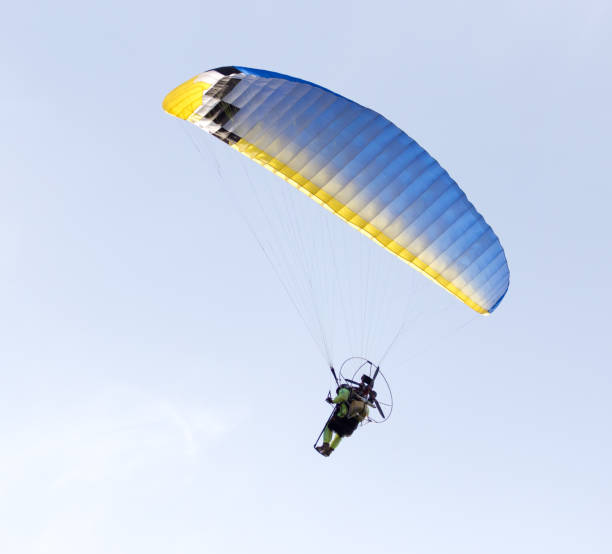 istock parachute flying in the sky 918681356