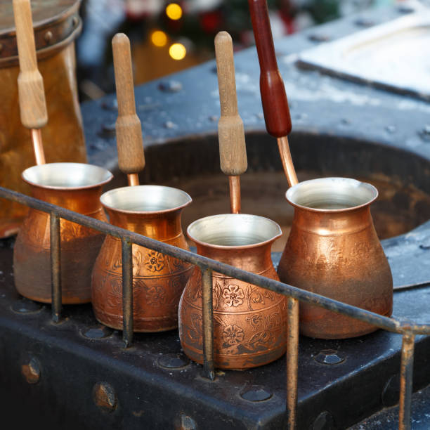 istock Several smoked pots for making Turkish coffee are stand on a metal table 918684816