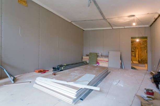 istock Working process of installing metal frames for plasterboard (drywall) for gypsum walls and tools in apartment is under construction, remodeling, renovation, extension, restoration and reconstruction. 918691750