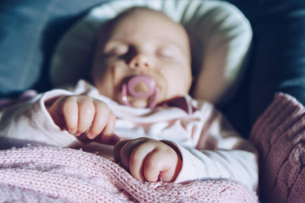 istock Close up of  baby hands while sleeping 918692024