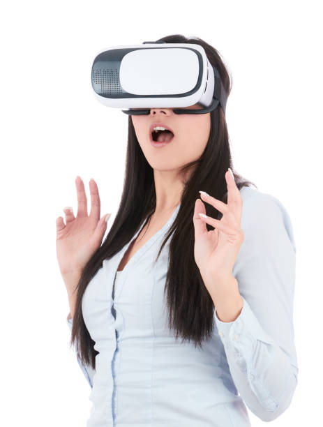 istock Young woman is using VR headset on white background 918692108