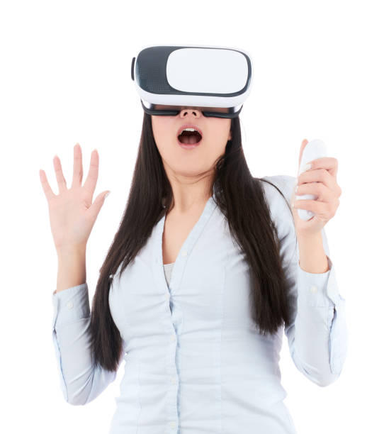 istock Young woman is using VR headset on white background 918692110