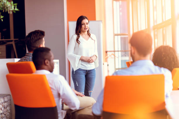 istock Group of casually dressed businesspeople discussing ideas in the office. 918694458