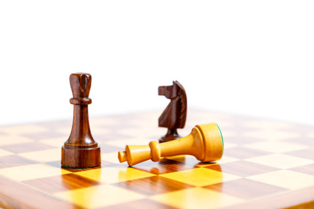 istock Wooden chess pieces on a chessboard 918694704