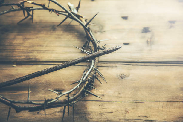 istock Crown of thorns on wood desk 918695176