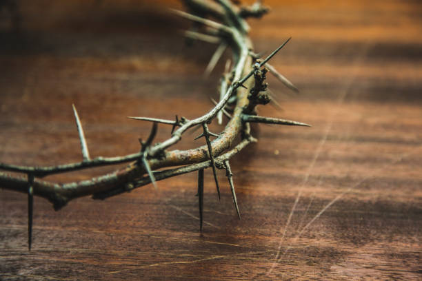 istock Crown of thorns on wood desk 918695190