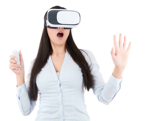 istock Young woman is using VR headset on white background 918695524