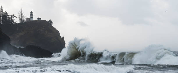 istock Ocean waves breaking on rocks below Cape Disappointment Lighthouse. 918698694