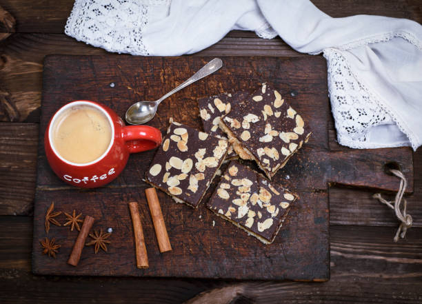 istock coffee with foam in a red ceramic mug on the kitchen cutting board 918699394