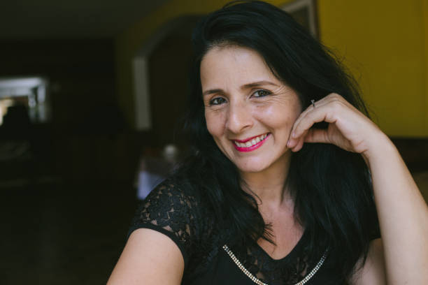 istock mature latin woman at cafe 918703108